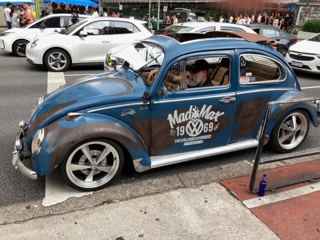 A view of an antique Volkswagen Beetle on Avenida Paulista in São Paulo