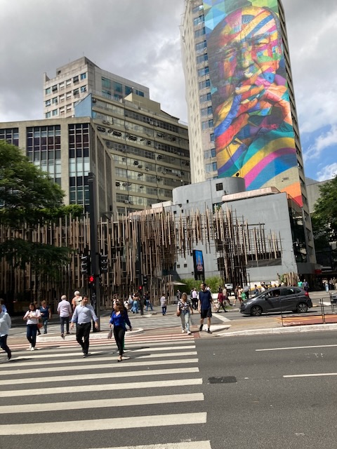 Brazilian architect Oscar Niemeyer, towers over São Paulo in Brazil in a mural by Artist Eduardo Kobra