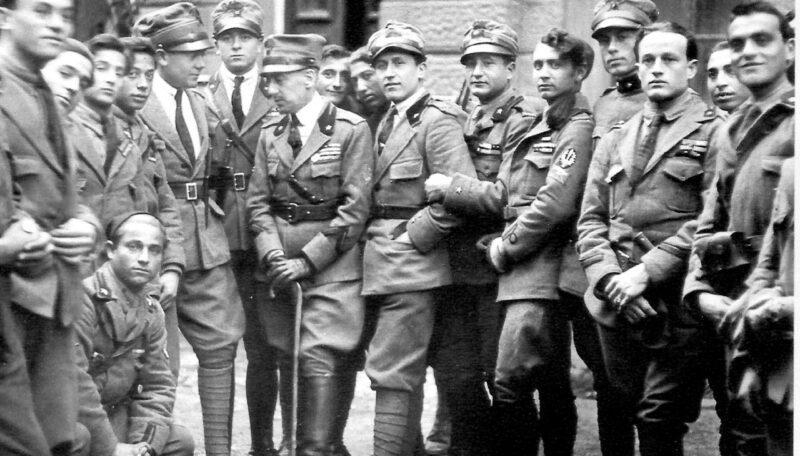 Gabriele D'Annunzio (in the middle with the stick) with some legionaries (components of the Arditi's department of the Italian Royal Army) in Fiume in 1919.