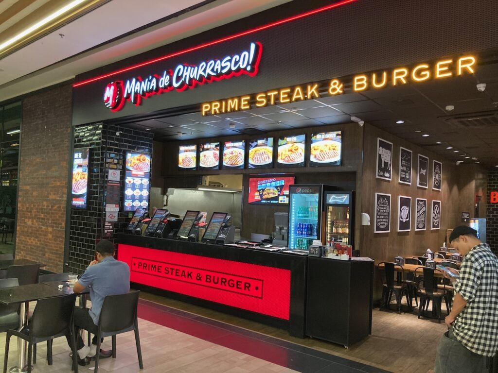 A view of a Mania de Churrasco! restaurant in the food court inside the Top Center Shopping mall on Avenida Paulista in São Paulo, Brazil