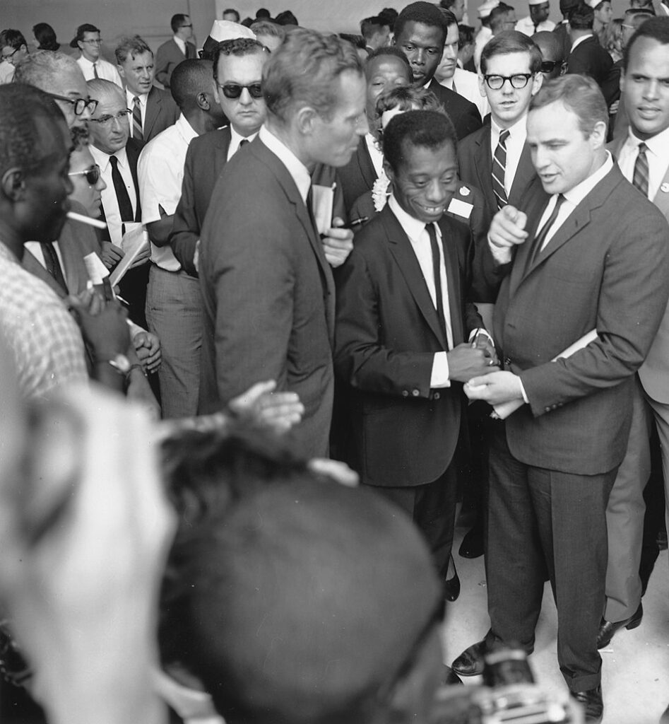 Civil Rights March on Washington, D.C. [Author James Baldwin with actors Marlon Brando and Charlton Heston.], 08/28/1963