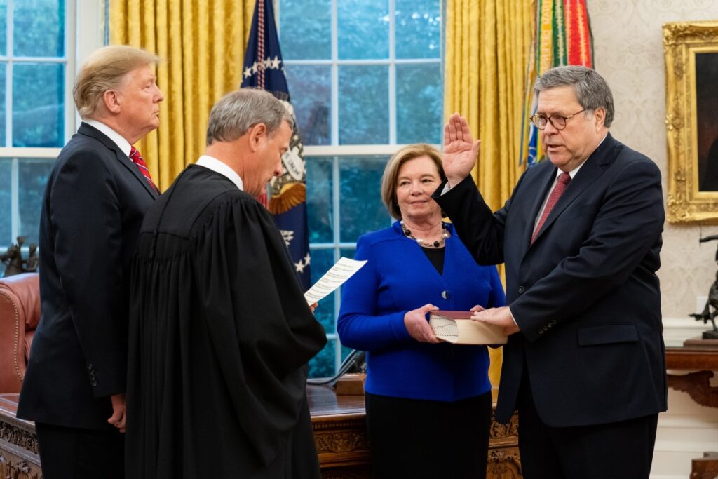 President Donald J. Trump participates in swearing-in of William P. Barr administered by U.S. Supreme Court Chief Justice John Roberts on February 14, 2019. Attorney General Barr's wife, Christine, holds the Bible. 14 February 2019