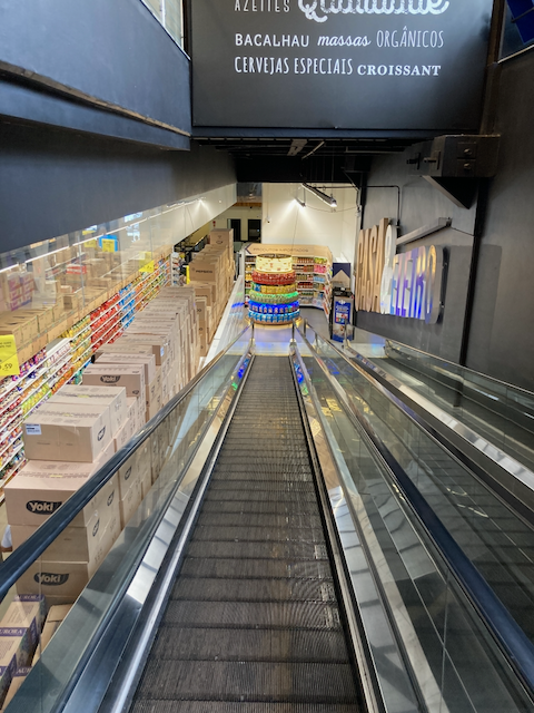 A view of a flat escalator that is intended to move shopping carts as well as people inside the Carrefour supermarket on Rua Pamplona in São Paulo, Brasil