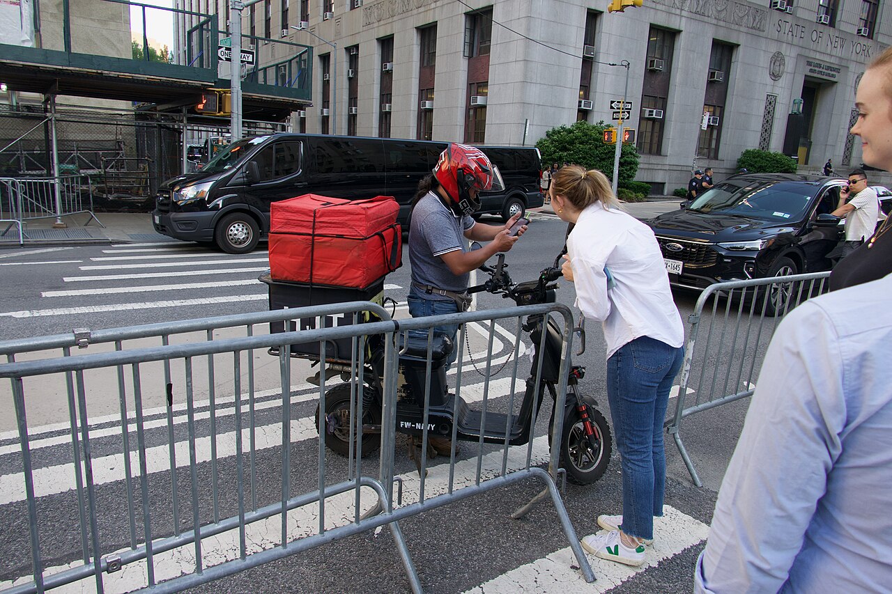 Delivery driver outside the courthouse for Donald Trump's New York criminal hush money trial. May 28, 2025. By SWinxy. Via Wikimedia Commons
